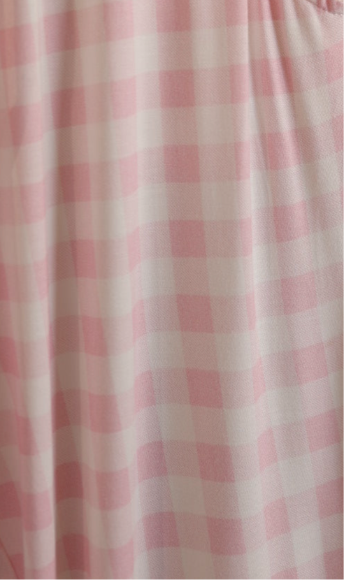 A close-up of forever french baby’s Bamboo Zip Pajamas | Pink Sugar, showing pink and white gingham checks with soft folds and gentle light—ideal for breathable, hypoallergenic baby sleepwear.