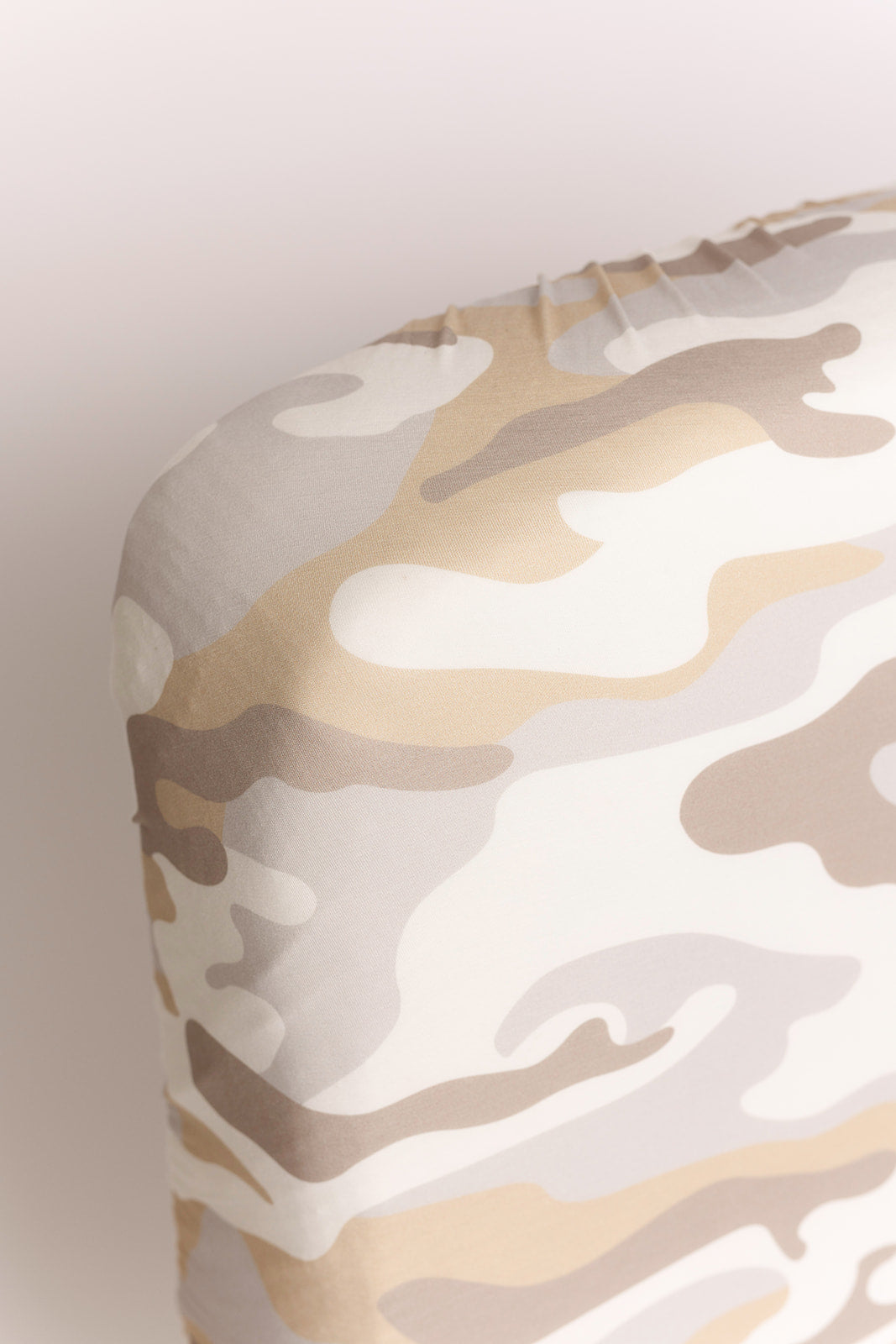 Close-up of the Bamboo Crib Sheet | Camo 2.0 by forever french baby fitted on a crib mattress, featuring a beige, brown, and white camo pattern—ideal for stylish nursery bedding.