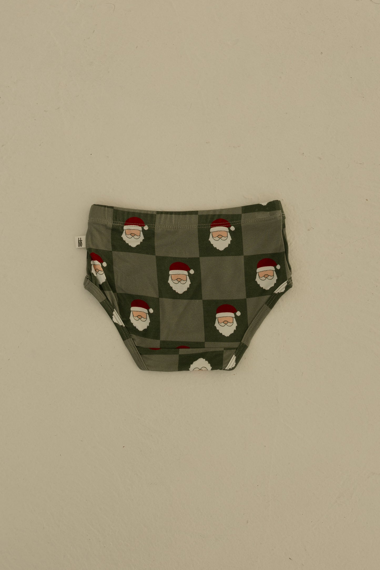 Forever french baby Girl's Bamboo Briefs (3 Pack) in Red Gingham, Candy Cane & Santa Checkerboard prints—shown flat on a light beige background. Made from hypo-allergenic bamboo for comfort and style.