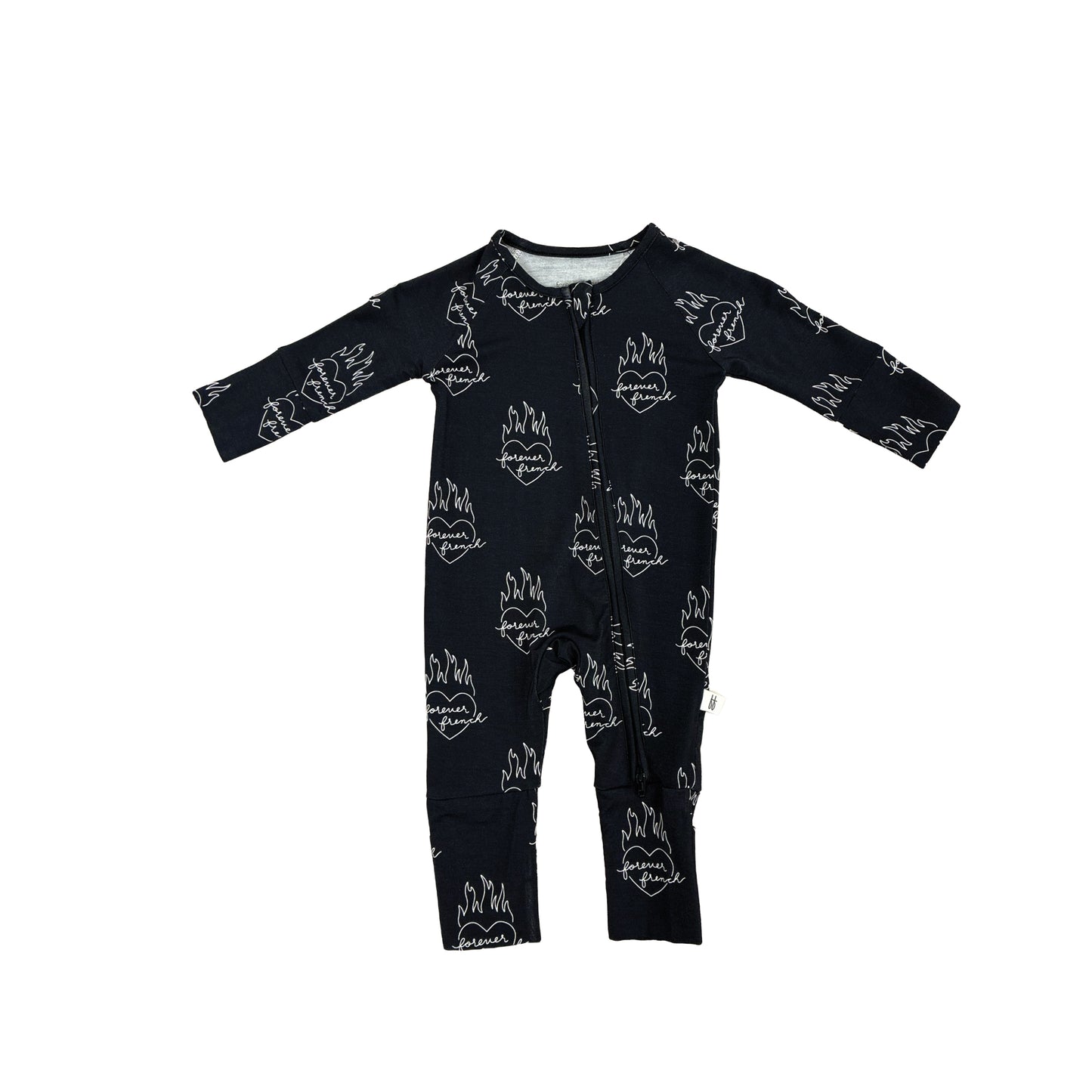 The Bamboo Zip Pajamas | Flaming Hearts by forever french baby features a black long-sleeved romper with white flaming lips and fire designs. Made from soft, breathable bamboo, it has a front zipper for easy wear and ensures all-night comfort for your baby.