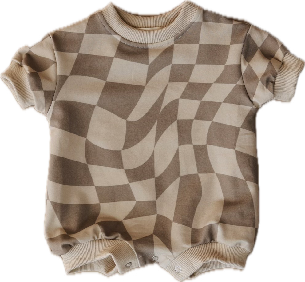 The Short Sleeve Romper | Wavy Checkerboard from forever french baby is a beige and cream short-sleeved onesie adorned with a wavy checker design. Constructed from organic cotton, it features ribbed cuffs, a collar, and snap closures at the bottom for easy changing.