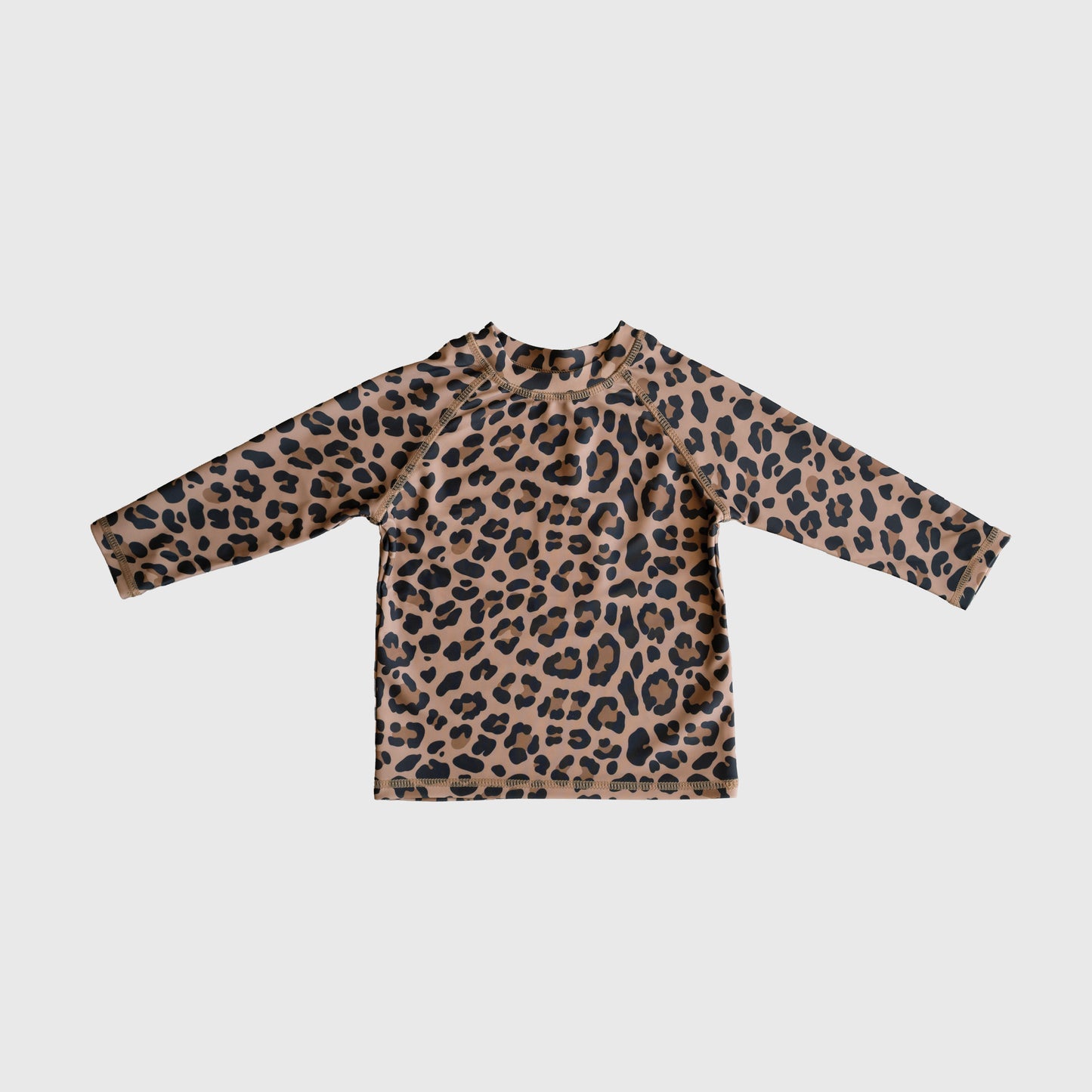 The *PRE-ORDER* Child Rash Guard | Leopard from forever french baby features a brown base with black leopard print—stylish kids swimwear laid flat on white, perfect for your little one.