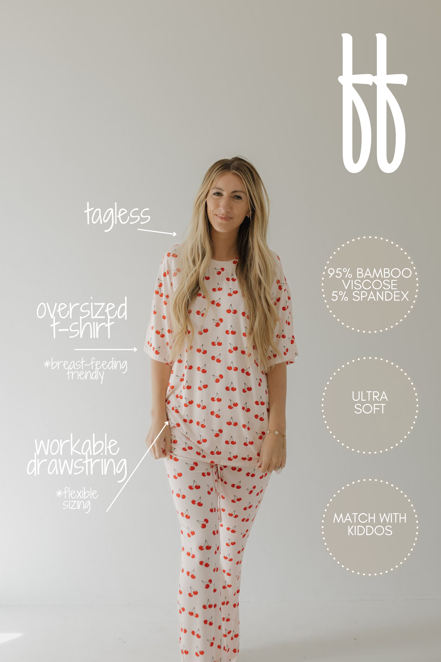 A woman poses in the Cherry Orchard Short Sleeve Women's Bamboo Pajamas by forever french baby against a plain backdrop. Key features include: "tagless," "breastfeeding-friendly," "workable drawstring," and made from 95% bamboo viscose, ensuring ultra-softness and hypoallergenicity for matching with kiddos.