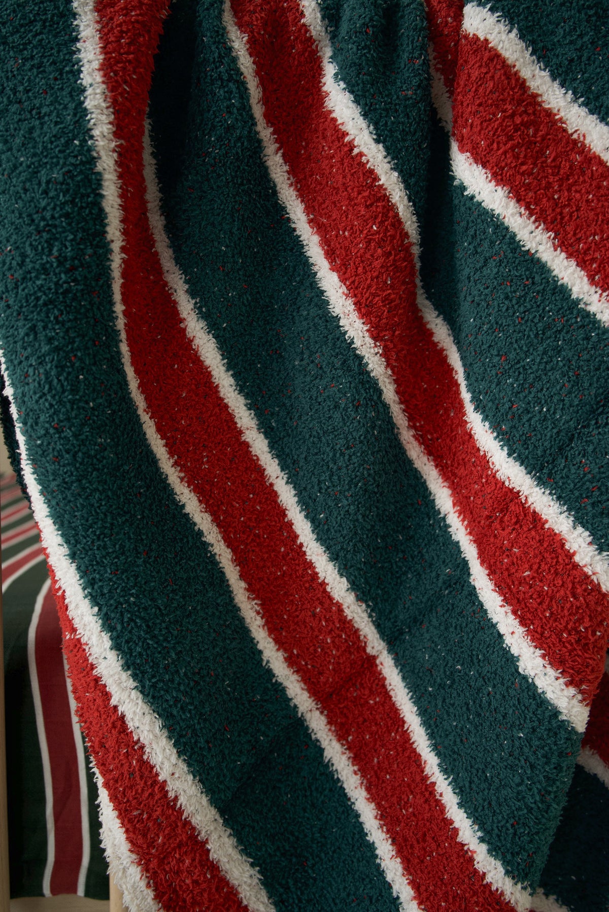 *PRE-ORDER* Plush Blanket | Holiday Stripe in dark green, red, and white with diagonal stripes.