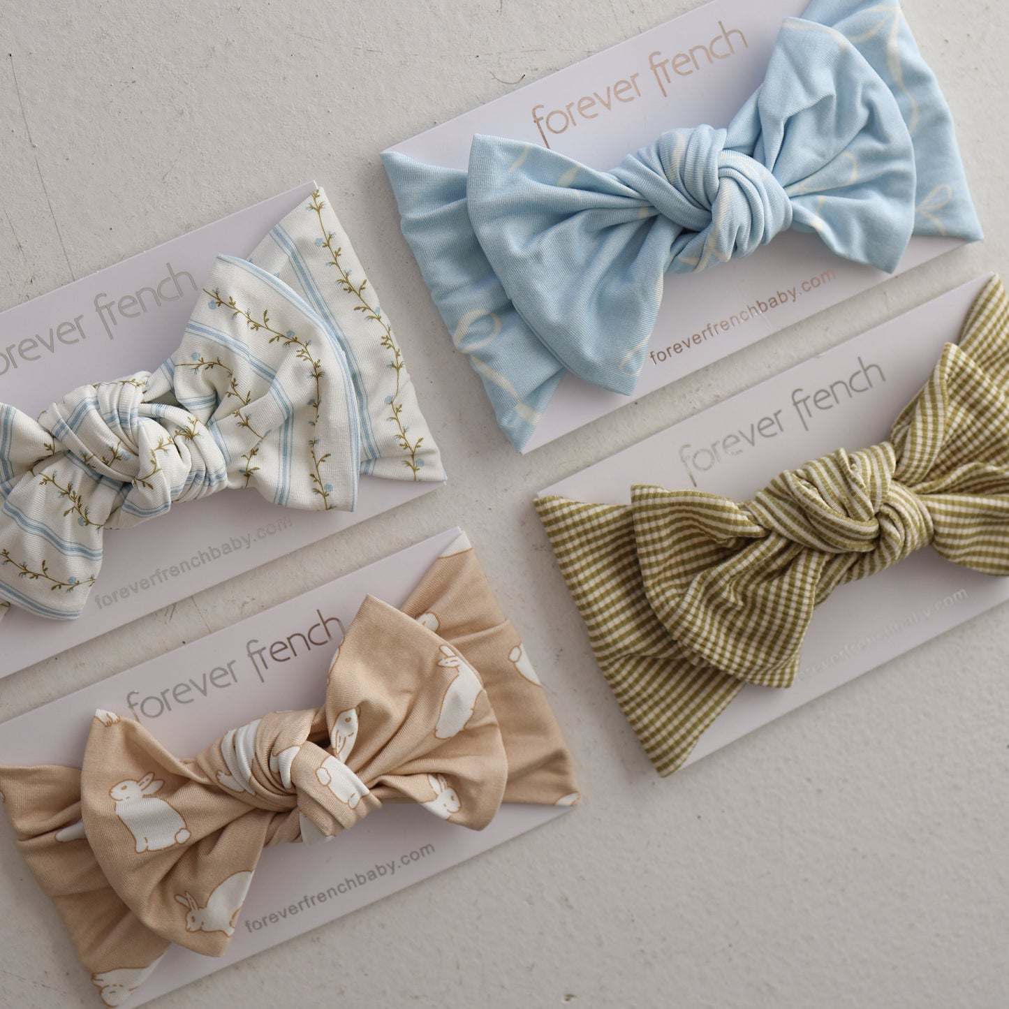 The Bamboo Head Wrap | Bunnies from forever french baby features a cute bunny pattern, making it a charming and soft accessory for your little one’s outfit.