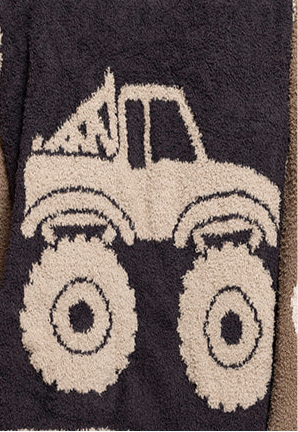 The forever french baby Plush Blanket | Monster Truck features a beige outline of a monster truck with large wheels on dark, textured fabric—crafted from soft microfiber for cozy comfort.
