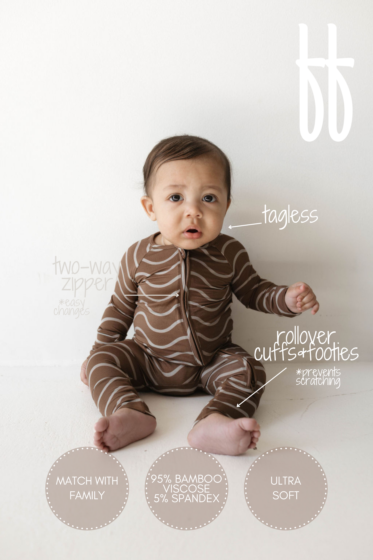 A baby sits on the floor wearing a brown and white striped onesie. Text around the baby highlights features of the ultra-soft Bamboo Zip Pajamas | Static Waves by forever french baby: "two-way zipper," "tagless," "rollover cuffs & footies," "95% bamboo viscose, 5% spandex," "match with family," and "hypo-allergenic clothing.