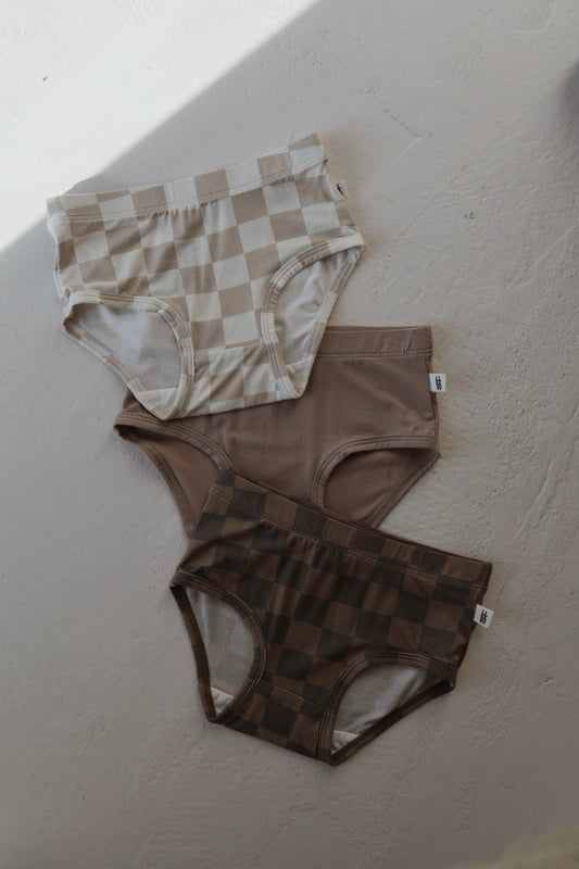 Forever french baby’s Girl's Bamboo Briefs (3 Pack) includes checkerboard, taupe, and faded checkerboard styles in neutral tones. Each simple-cut pair is made from soft, hypo-allergenic bamboo for comfort and style.