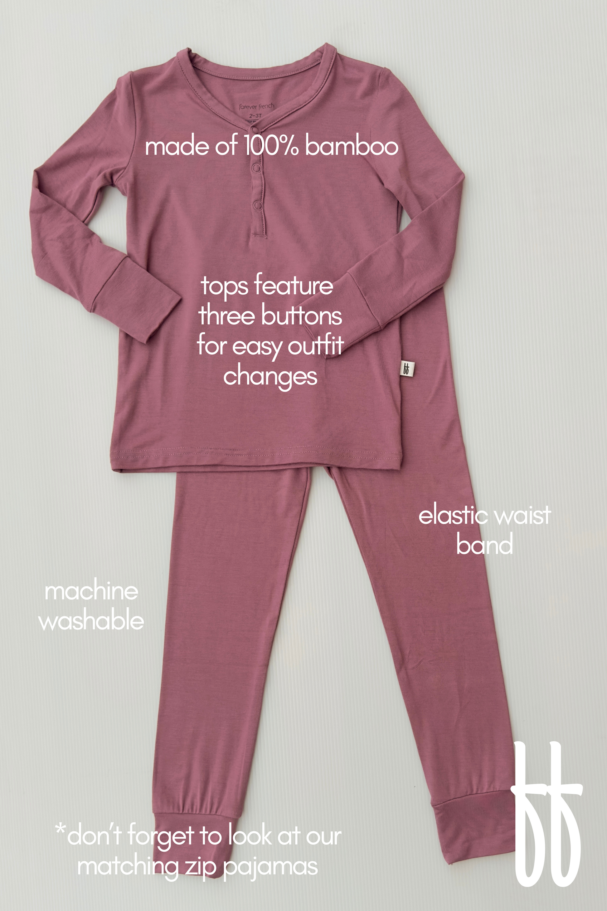 Introducing the "Bamboo Two Piece Pajamas | Amethyst" by forever french baby. This set includes a long-sleeve top with three button details and pants featuring an elastic waistband, all crafted from 100% bamboo fabric for breathable comfort. Easily machine washable, these pajamas offer relaxed sleepwear style. Additionally, matching zip pajamas are available for a coordinated look.