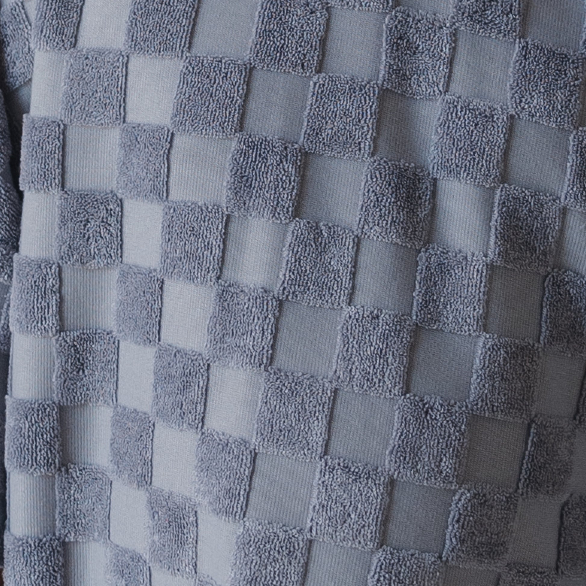 Close-up of the Child Terry Short Set | Tradewinds by forever french baby, showing its gray checkerboard textured fabric with alternating smooth and fuzzy squares—ideal for cozy kids’ wear or matching family outfits.
