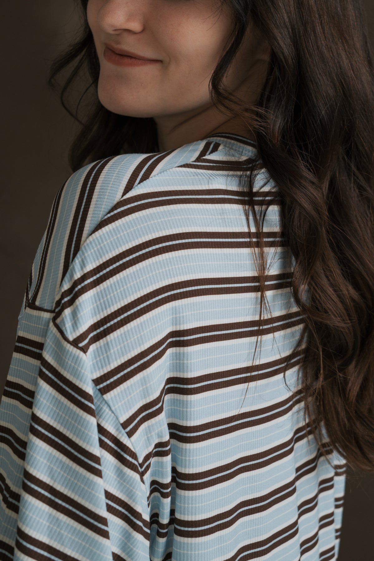 A person wearing a blue and brown striped Women’s Boxy Tee Lounge Set | Dean, featuring a boxy, breathable fit.