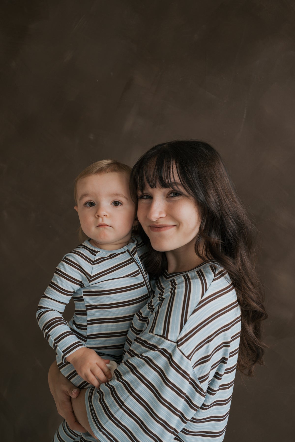 A woman and young child wearing matching blue and brown striped breathable Women’s Boxy Tee Lounge Set | Dean loungewear.