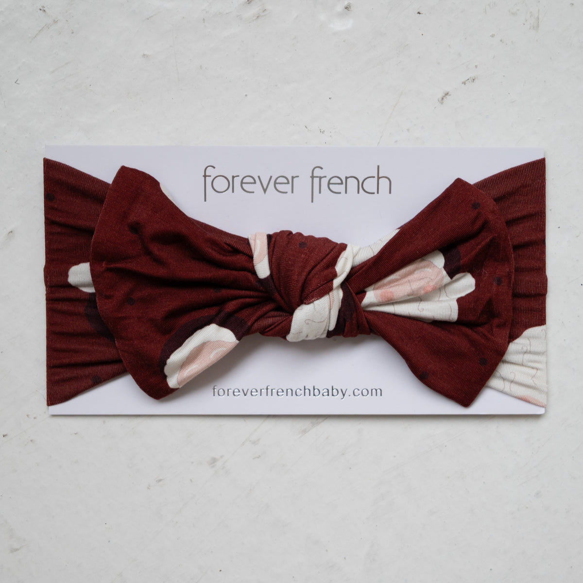 Maroon Bamboo Head Wrap | Vintage Santa baby head wrap featuring a white vintage Santa Claus pattern, displayed on a forever french baby branded product card.