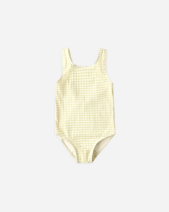 The Rylee + Cru Moxie One-Piece in Citron Stripe is a sleeveless swimsuit featuring a light yellow striped design and UPF 50+ protection, shown laid flat on a plain white background.