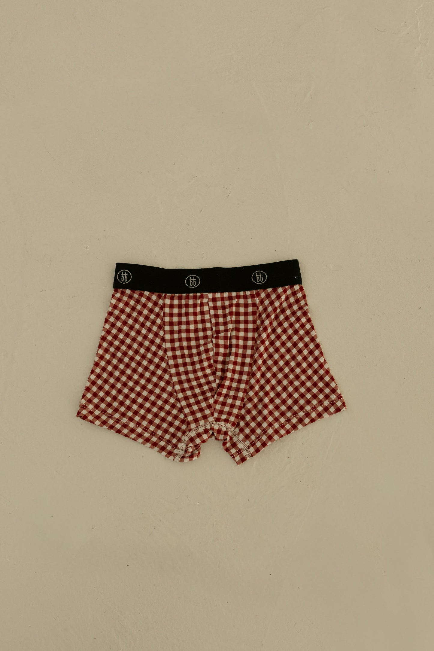 Forever french baby Bamboo Boxers (3 Pack) in Red Gingham, Candy Cane & Santa Checkerboard feature a black logo waistband; hypoallergenic and comfortable men's underwear, shown laid flat on a light surface.