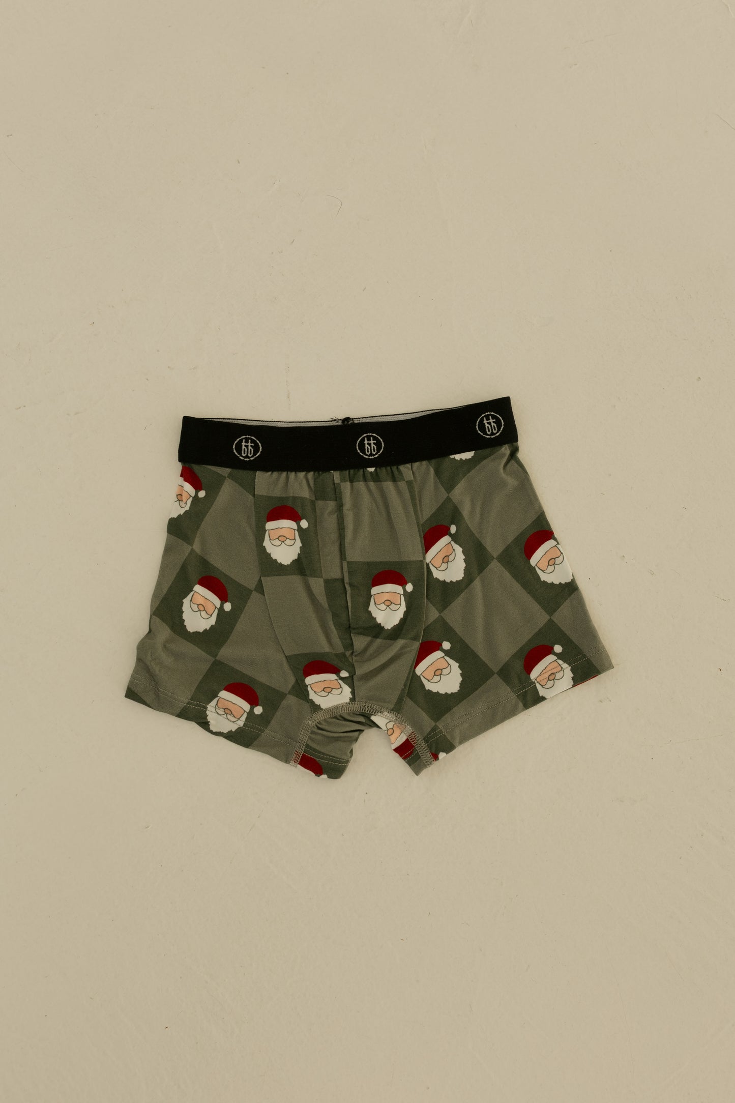 Forever french baby Bamboo Boxers (3 Pack) in Red Gingham, Candy Cane & Santa Checkerboard feature hypoallergenic fabric and a black waistband with a white logo. Festive boys’ underwear shown flat on a neutral surface.