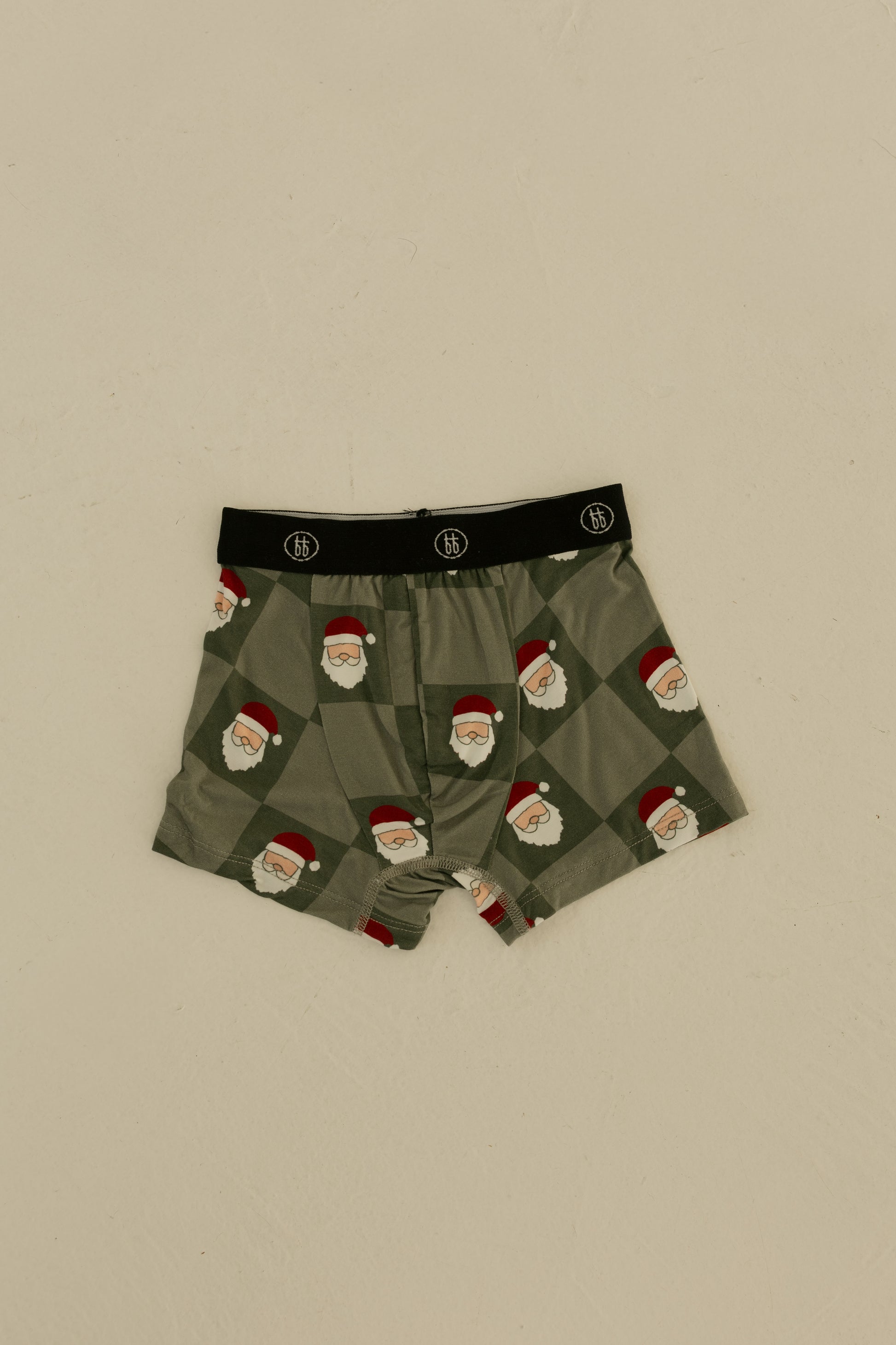 Forever french baby Bamboo Boxers (3 Pack) in Red Gingham, Candy Cane & Santa Checkerboard feature hypoallergenic fabric and a black waistband with a white logo. Festive boys’ underwear shown flat on a neutral surface.