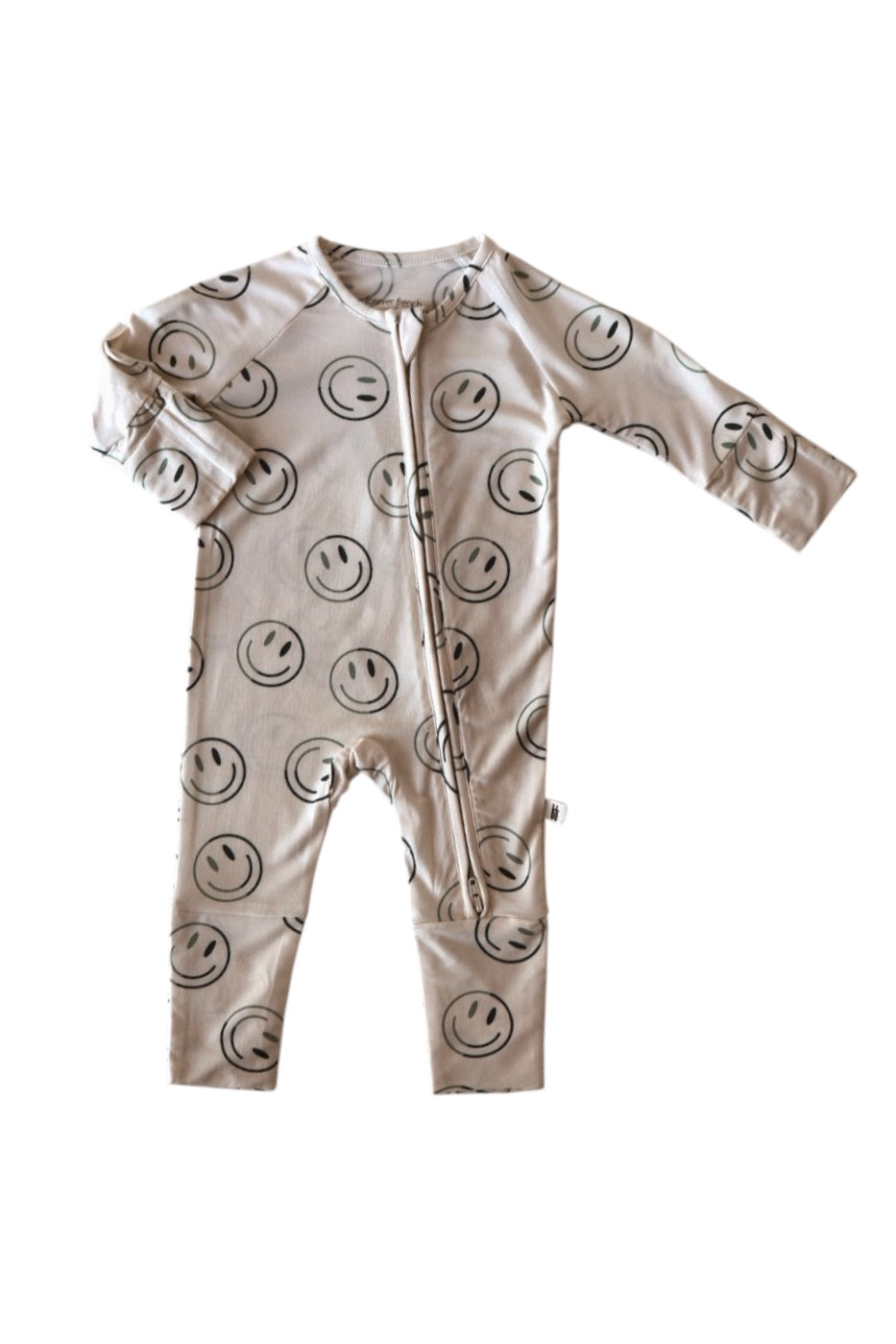 The forever french baby Bamboo Zip Pajama | Green Smiles is a green long-sleeve onesie featuring black smiley face prints, made from breathable bamboo fabric, with a handy diagonal zipper from collar to left leg.