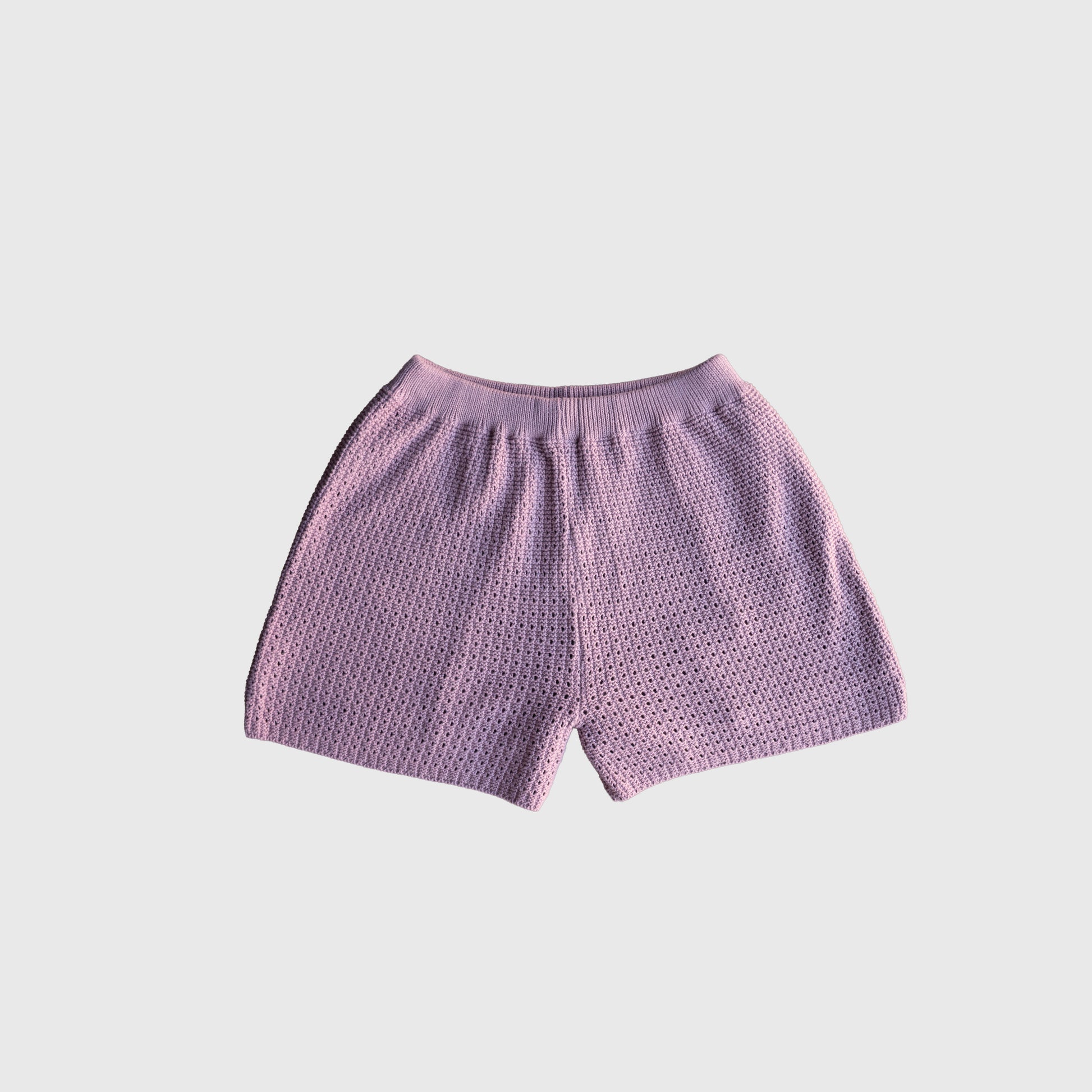 The Women's Knit Short Set | Matilda by forever french baby features pink textured shorts made from 100% cotton with an elastic waistband, displayed flat on a white background.