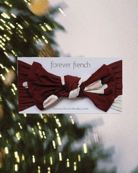 Dark red Bamboo Head Wrap | Vintage Santa with a center knot on display packaging.