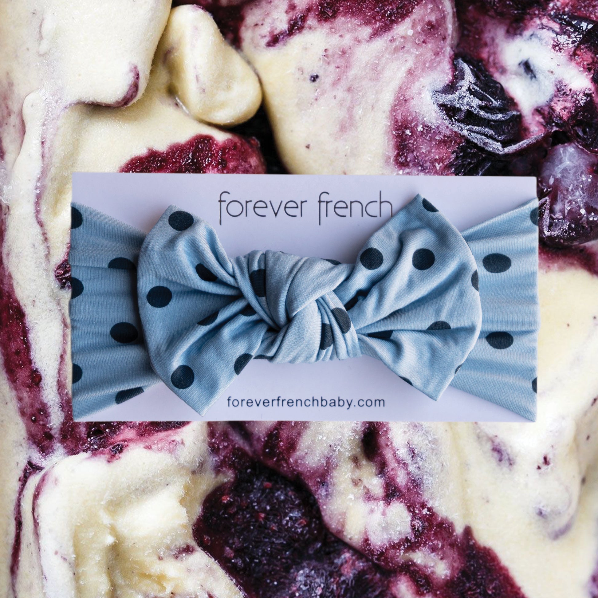 A Bamboo Head Wrap | Sully by forever french baby is displayed over a swirled mix of vanilla and berry ice cream.
