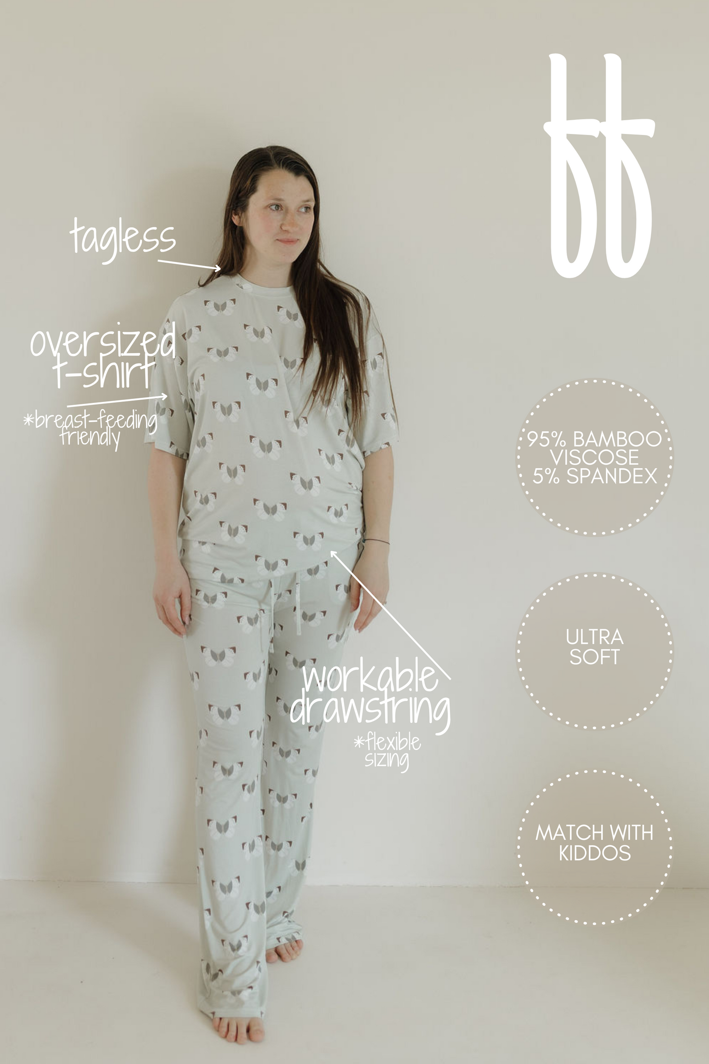 A person is against a plain backdrop wearing the "Short Sleeve Women's Bamboo Pajamas | Butterflies" by forever french baby. Features include: tagless, oversized fit, workable drawstring, 95% bamboo viscose for ultra-soft comfort. Breastfeeding-friendly and hypo-allergenic with matching options available.