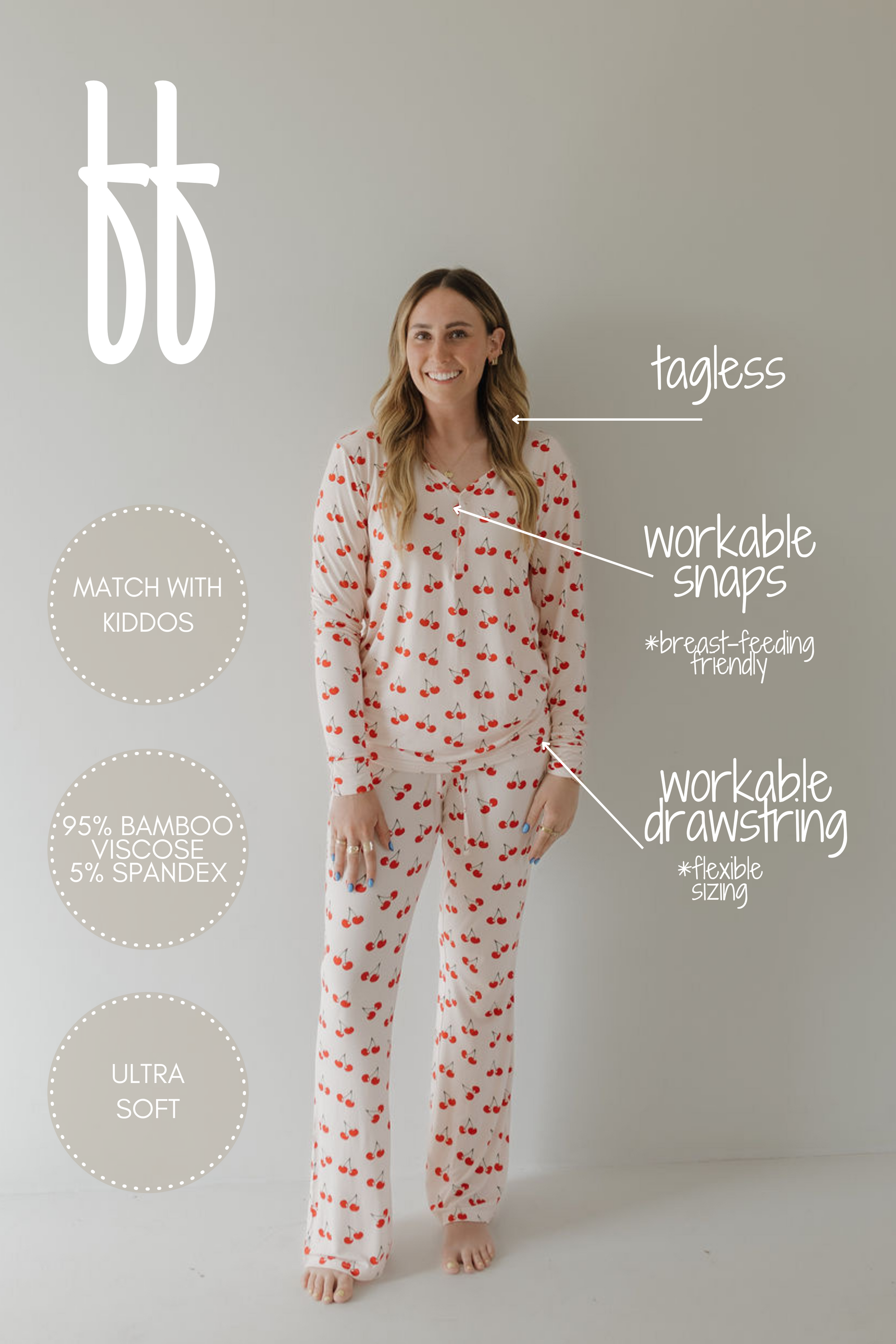 A woman in Cherry Orchard pajamas by forever french baby smiles against a neutral backdrop. Made from 95% bamboo viscose and 5% spandex, these tagless hypo-allergenic pajamas feature ultra-soft fabric, workable snaps and drawstring, and can be matched with kiddos for year-round comfort.