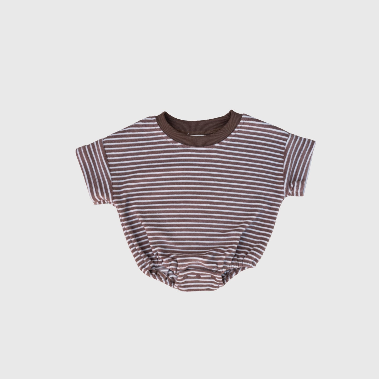 The forever french baby Terry T-Shirt Romper | Cola Stripe features brown and white stripes, a dark brown collar, and elastic leg openings—ideal for baby romper fans or coordinating matching family outfits.