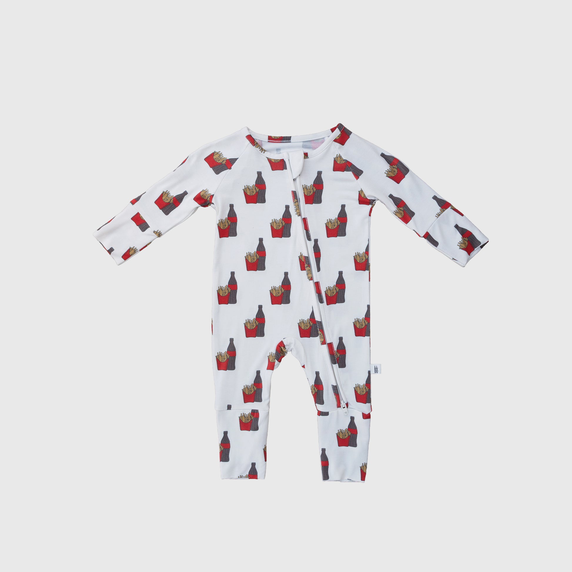 The forever french baby Bamboo Zip Pajamas | Fries & Cola are hypo-allergenic white long-sleeve onesies with a diagonal zipper and a fun red and yellow French fries pattern.