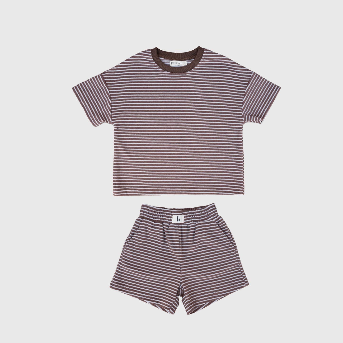 The forever french baby Child Terry Short Set | Cola Stripe features a short-sleeved tee and shorts with brown and white stripes, made from soft cotton-polyester kids shorts fabric, shown on a plain white background.