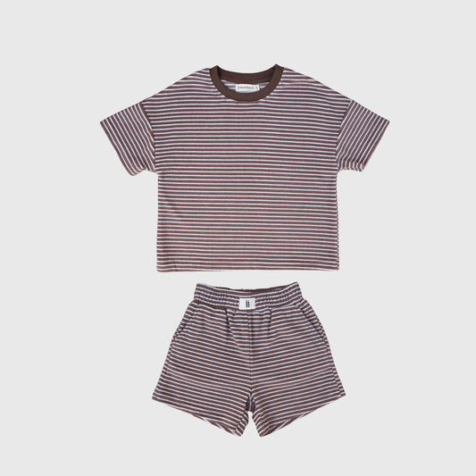 The forever french baby Child Terry Short Set | Cola Stripe features a short-sleeved tee and shorts with brown and white stripes, made from soft cotton-polyester kids shorts fabric, shown on a plain white background.
