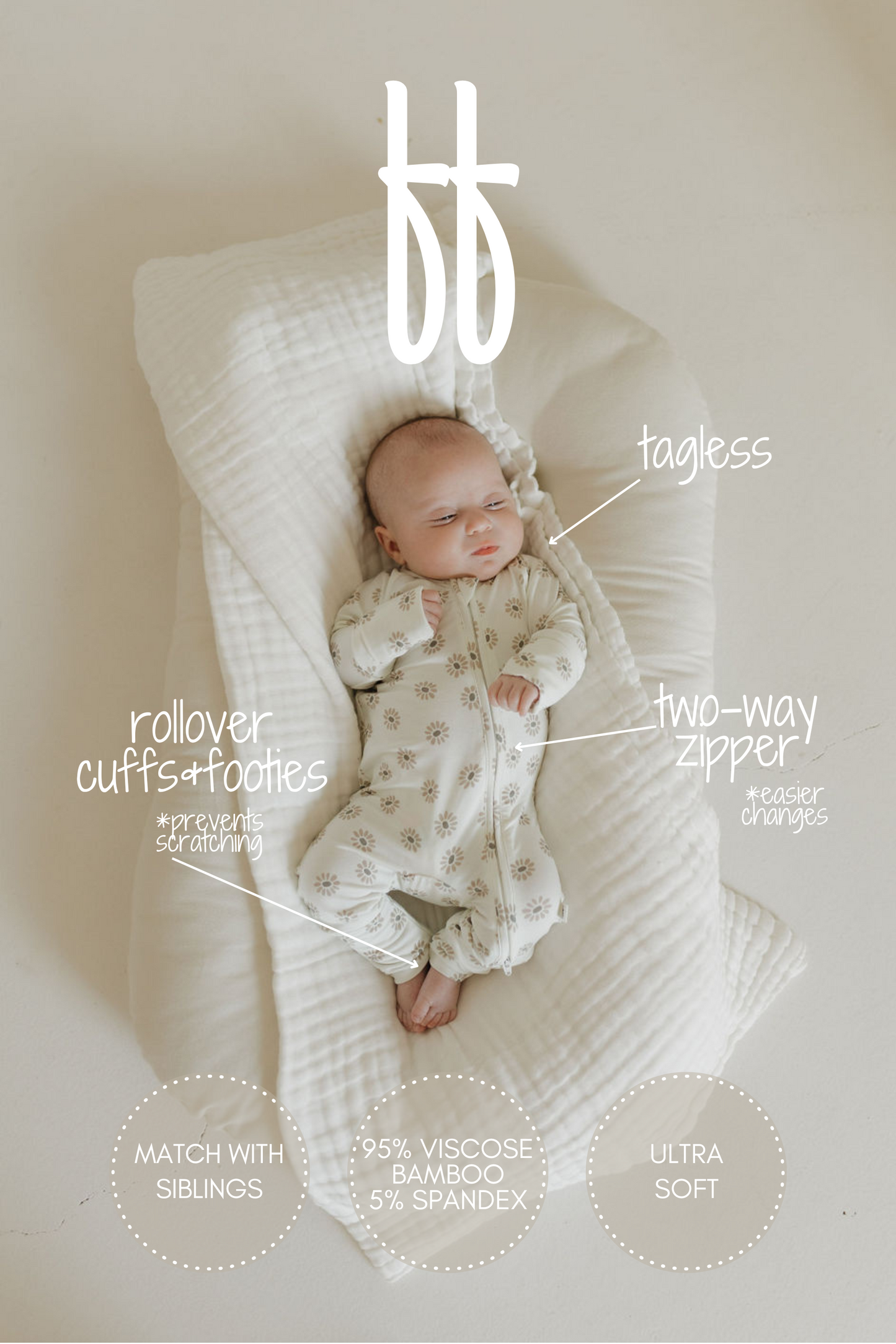 A baby rests on a soft white cushion in a Daisy Fields onesie by forever french baby, showcasing the hypo-allergenic Bamboo Zip Pajamas with rollover cuffs, footies, tagless design, two-way zipper, and 95% viscose from bamboo for ultra-soft sleepwear comfort.