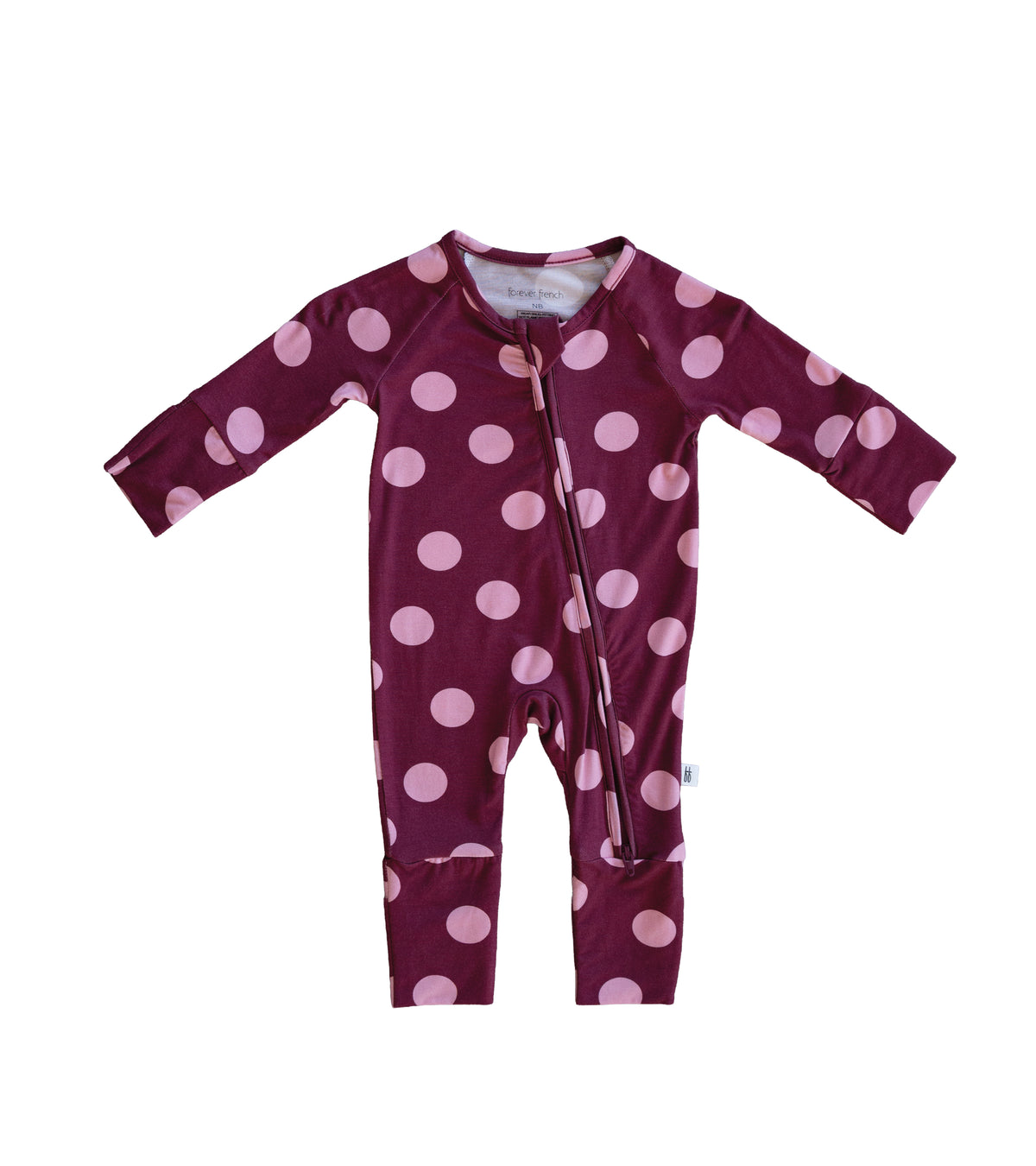 Dress your little one in cozy comfort with the forever french baby Bamboo Zip Pajamas in Heather Rose Dot. This maroon, long-sleeve onesie is adorned with large light pink polka dots and features a diagonal zipper from neck to left leg for easy changes. Made from breathable fabric, these pajamas help keep your baby comfortable all night long.