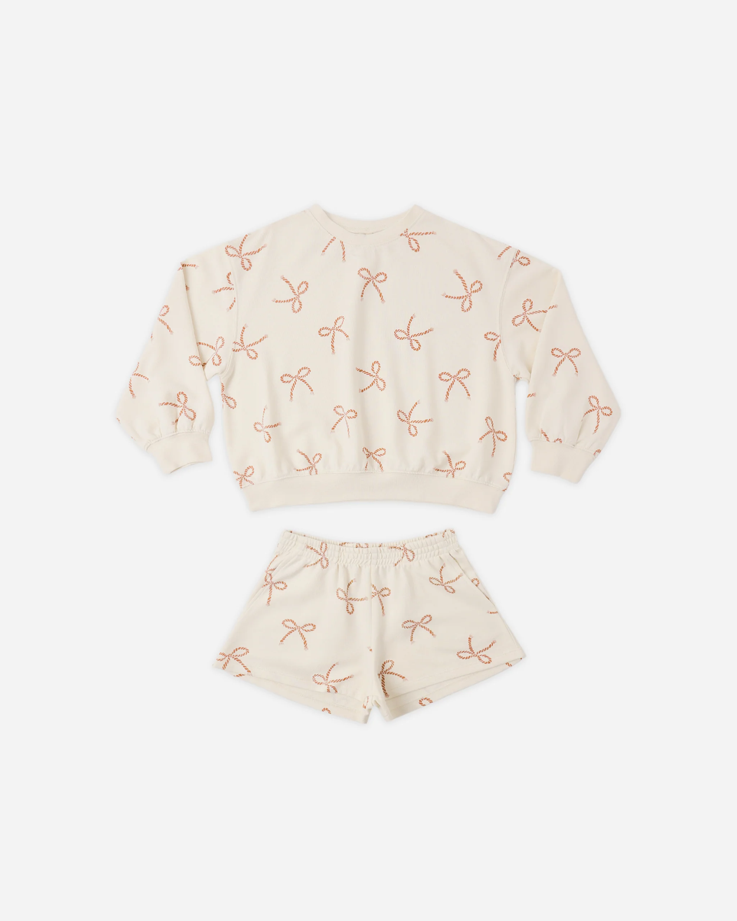 The Summer Terry Set | Sailor Bows by Rylee + Cru includes a soft French terry cream sweatshirt and shorts with an all-over red sailor bows print, both shown flat on a white background.