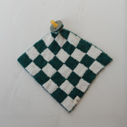 The Lovey | Lucky Micro Check by forever french baby is a green and white checkered comforter with a yellow pacifier attached, crafted from soft microfiber feather yarn and shown lying flat on a light surface.