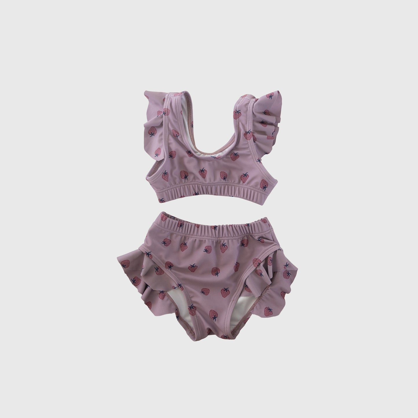 Girl's Two Piece Swimsuit | Matilda by forever french baby: pink strawberry print kids swimwear with ruffled shoulder straps and leg openings, shown on a plain white background.