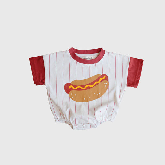 The Short Sleeve Romper | Hot Dog by forever french baby is perfect for family matching, featuring red sleeves, a white body with red stripes, and a playful hot dog graphic on the front.