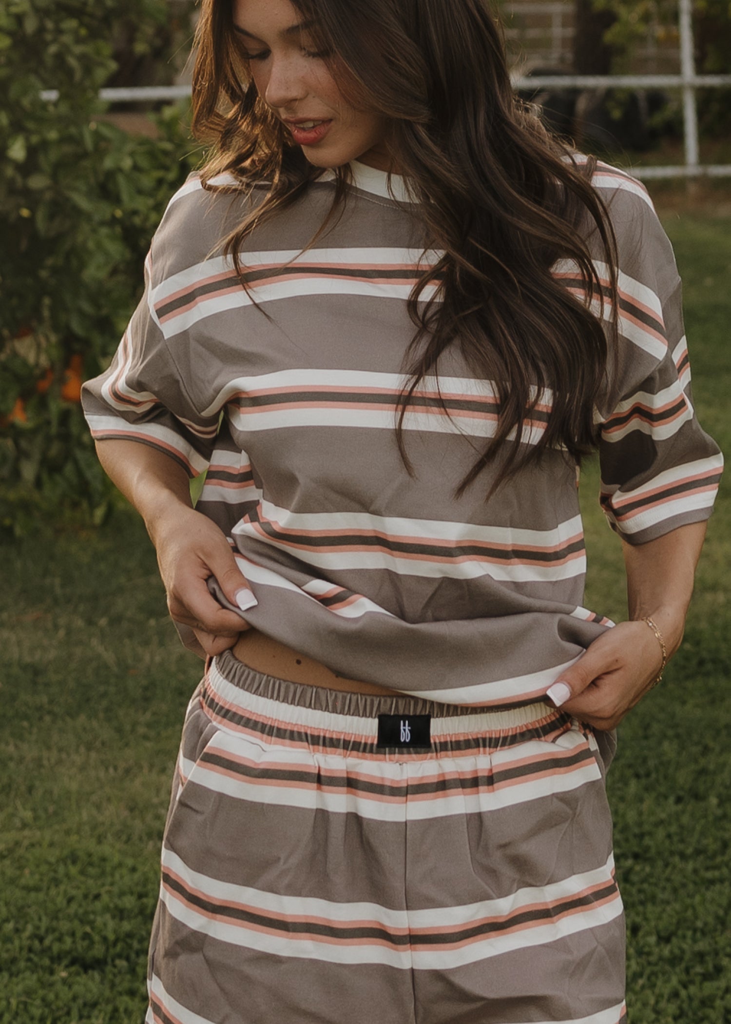 Relax in style outdoors with the forever french baby Women's Short Set | Sedona Stripe, featuring gray, white, and rust-colored stripes—crafted from cotton for ultimate comfort.