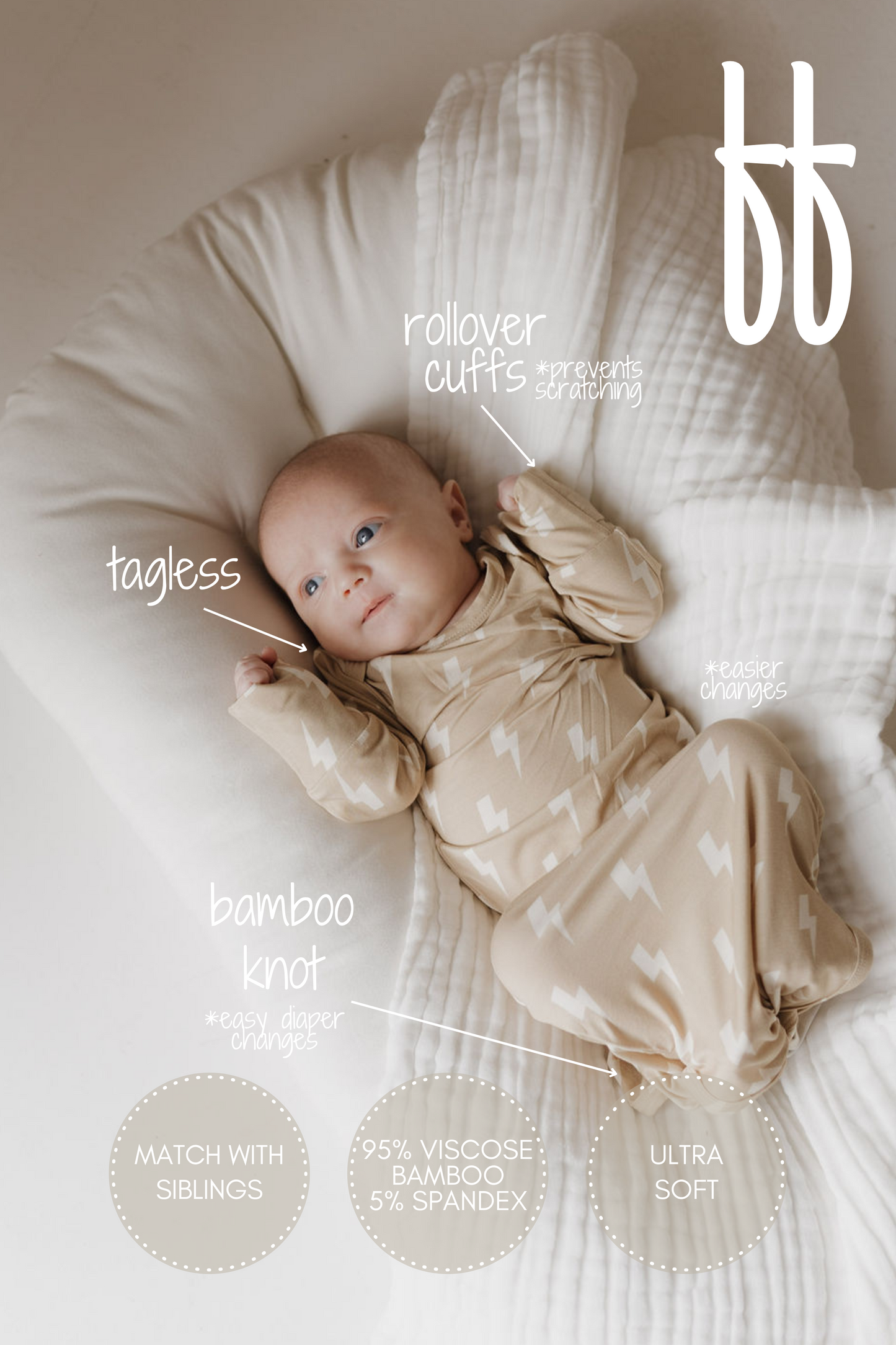 A newborn in a Bamboo Knotted Gown | Tan Lightning Bolt from forever french baby lies on a white blanket. Features: tagless, bamboo knot for easy diaper changes, rollover cuffs, and ultra-soft hypoallergenic bamboo fabric—truly a newborn essential.