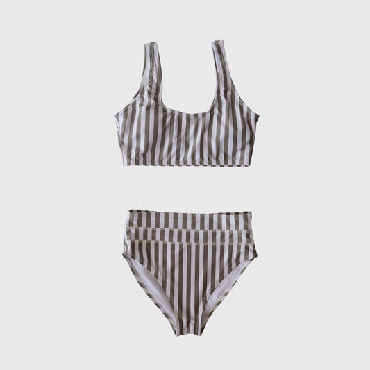 The forever french baby Women's Two Piece Swimsuit | Olive Stripe features vertical beige and white stripes, a scoop-neck top, and a high-waisted, high-leg bottom, shown on a plain white background.