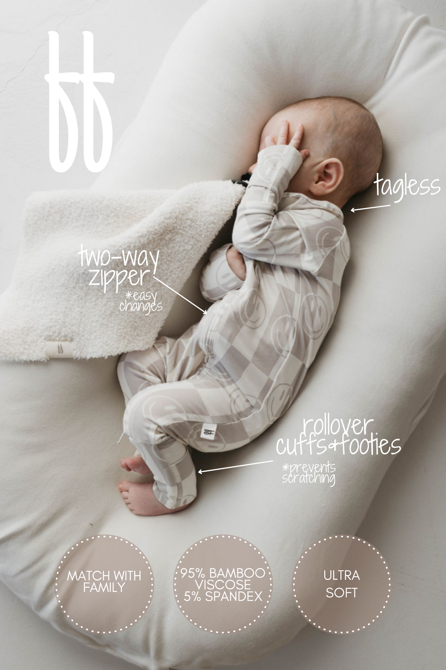 A baby rests on a white cushion, dressed in a light-colored Bamboo Zip Pajamas from the "Smile Checkerboard" collection by forever french baby. The text emphasizes the onesie's features: it has a two-way zipper, rollover cuffs and footies, and a tagless design. Three text circles highlight its hypoallergenic fabric composition composed of 95% bamboo viscose and 5% spandex, softness, and the option for family matching.