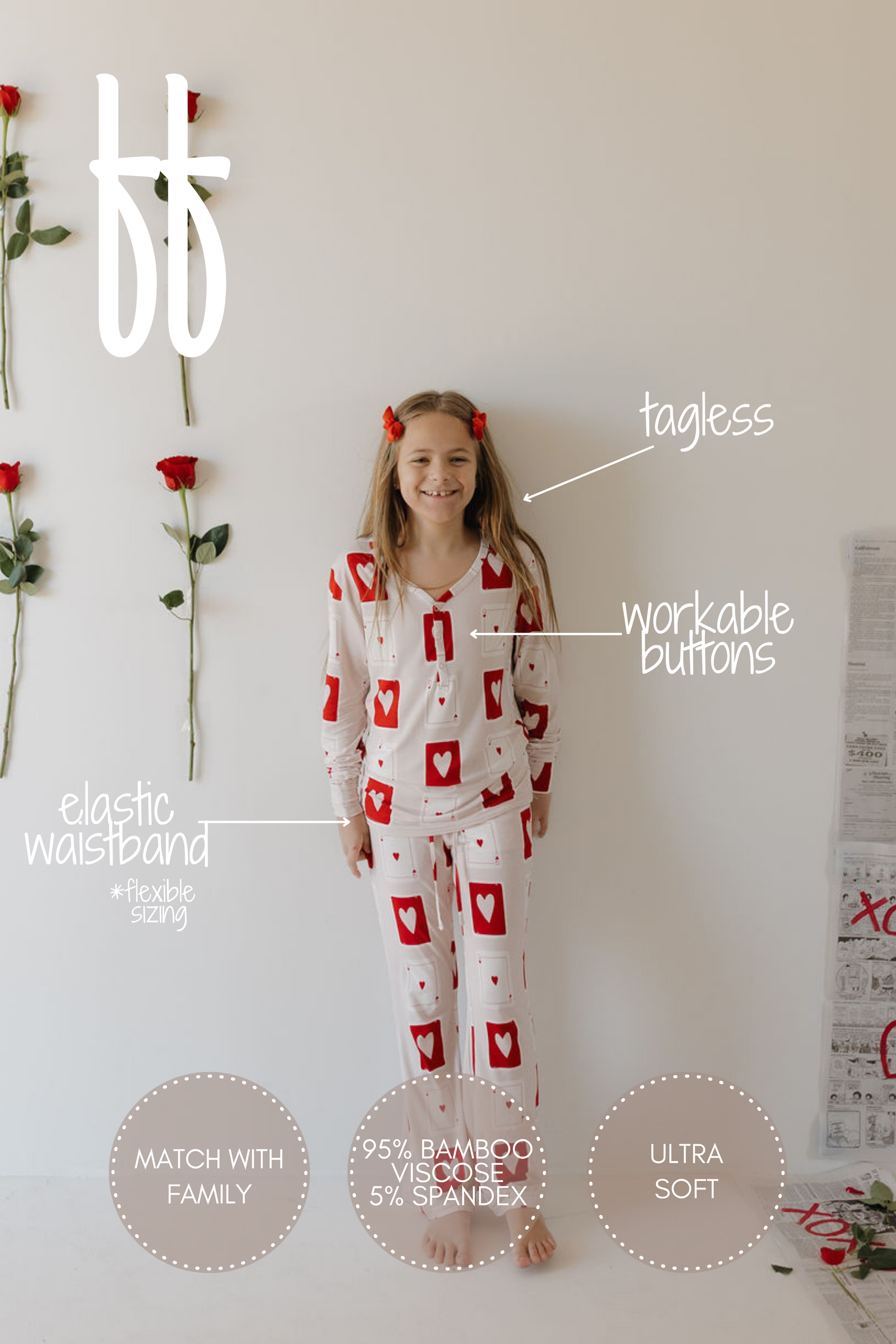 A child in forever french baby Youth Flare Bamboo Pajamas | Love Day, featuring a tagless design, workable buttons, an elastic waistband, and ultra-soft hypoallergenic fabric (95% bamboo viscose, 5% spandex), stands against a white wall. These pajamas offer match-with-family styling.