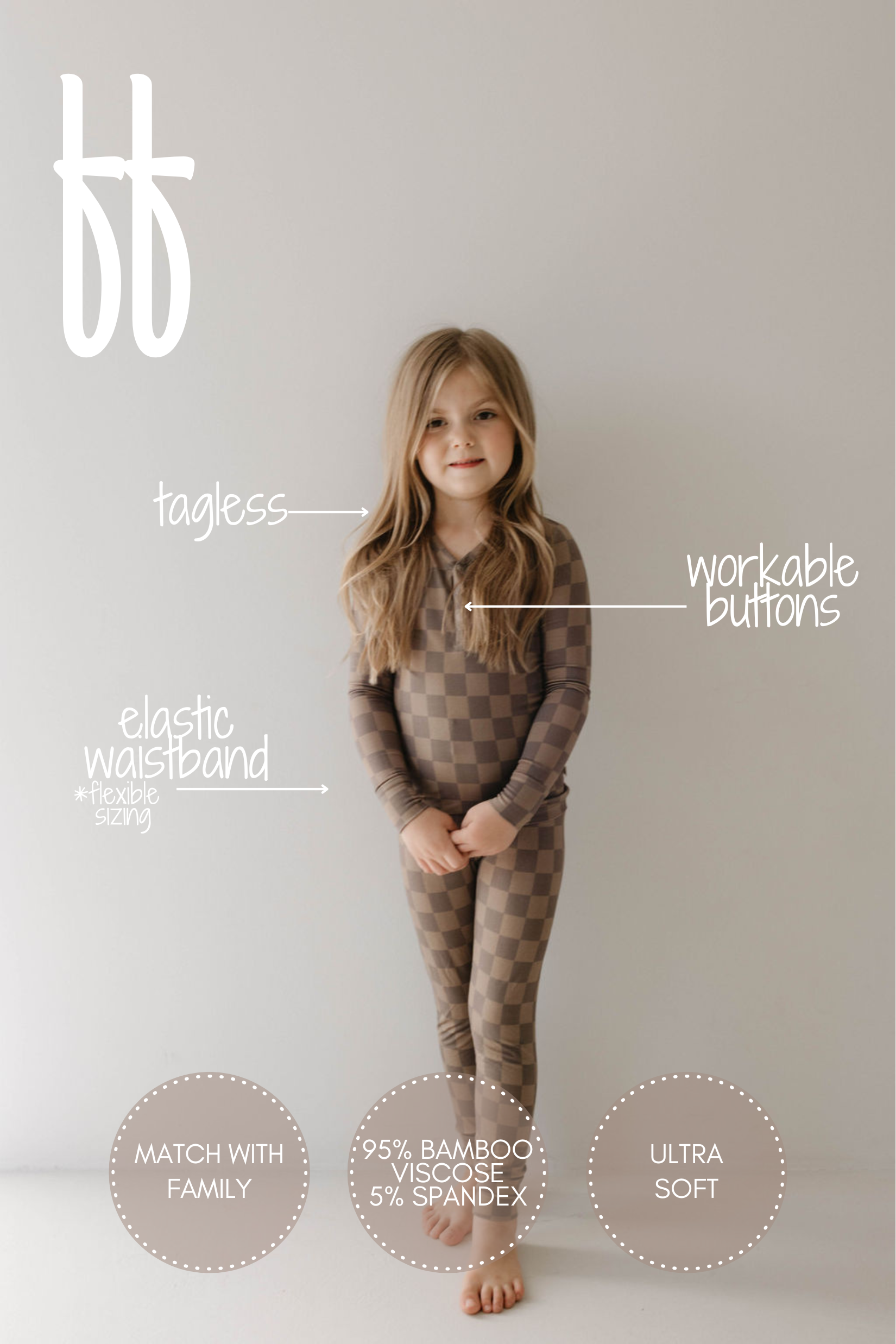 A young child with long hair stands against a plain light-colored background wearing breathable sleepwear by forever french baby, including the Bamboo Two Piece Pajama in Faded Brown Checkerboard. Text overlays highlight features like an elastic waistband, workable buttons, tagless design, and hypoallergenic fabric composition.