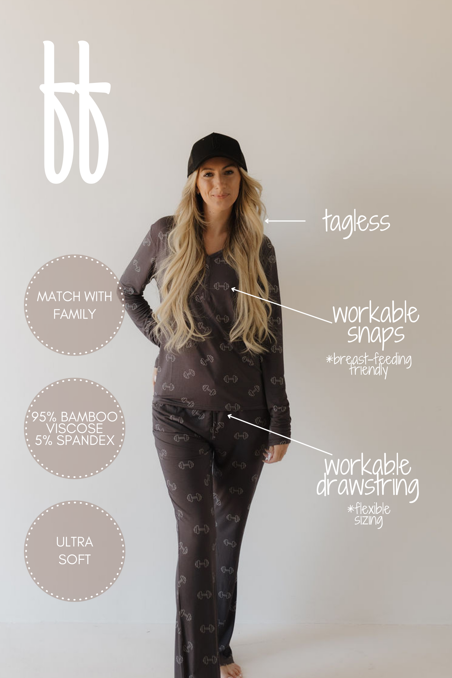 A person with long blonde hair, wearing a black cap and charcoal loungewear, likely Women's Bamboo Pajamas by forever french baby, featuring workable snaps and breathable hypo-allergenic fabric with a subtle pattern, walks indoors. The design is also tagless for comfort.