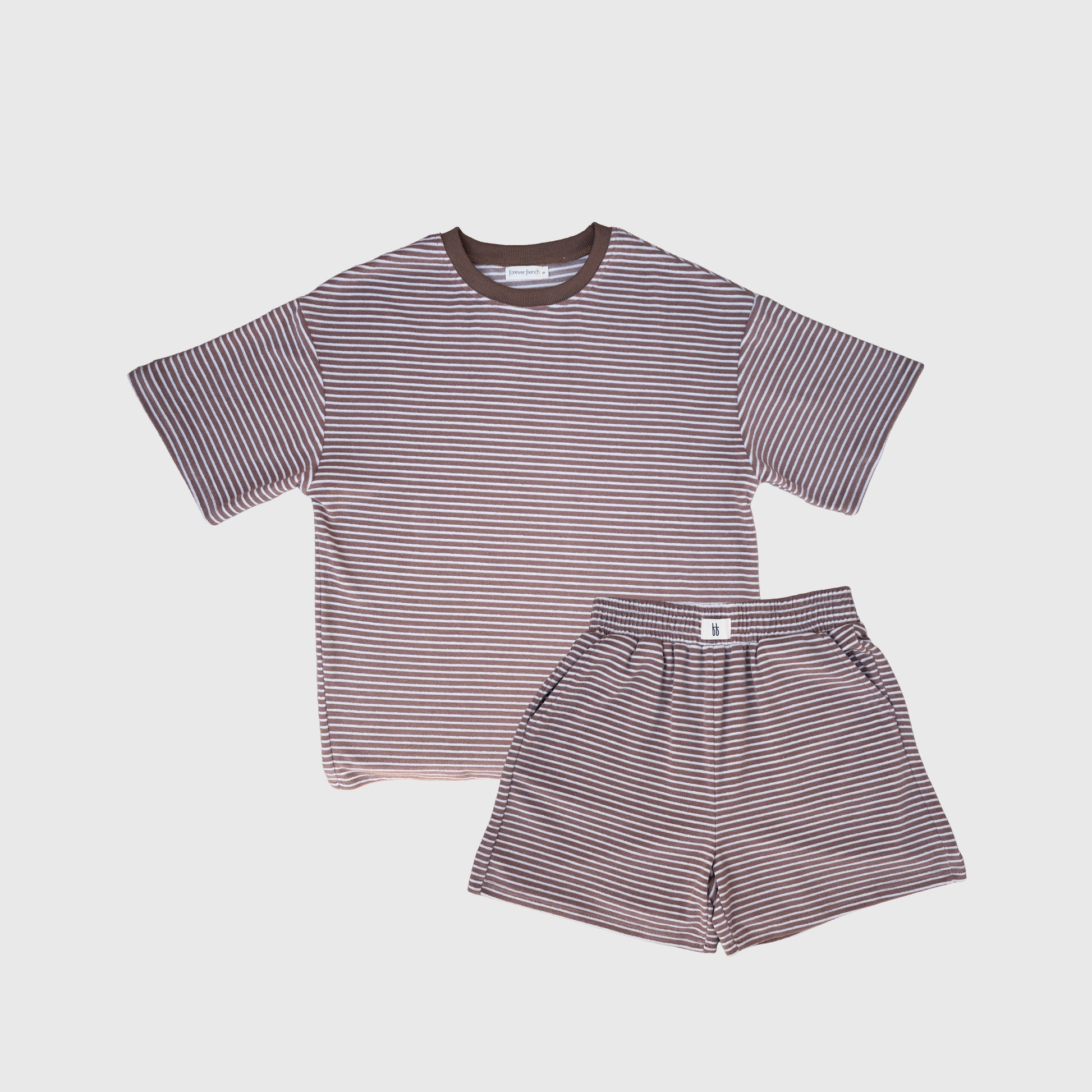 The forever french baby Women's Terry Short Set | Cola Stripe features a matching short-sleeve tee and shorts with thin brown and white stripes, ideal for loungewear. Shown on a plain white background.