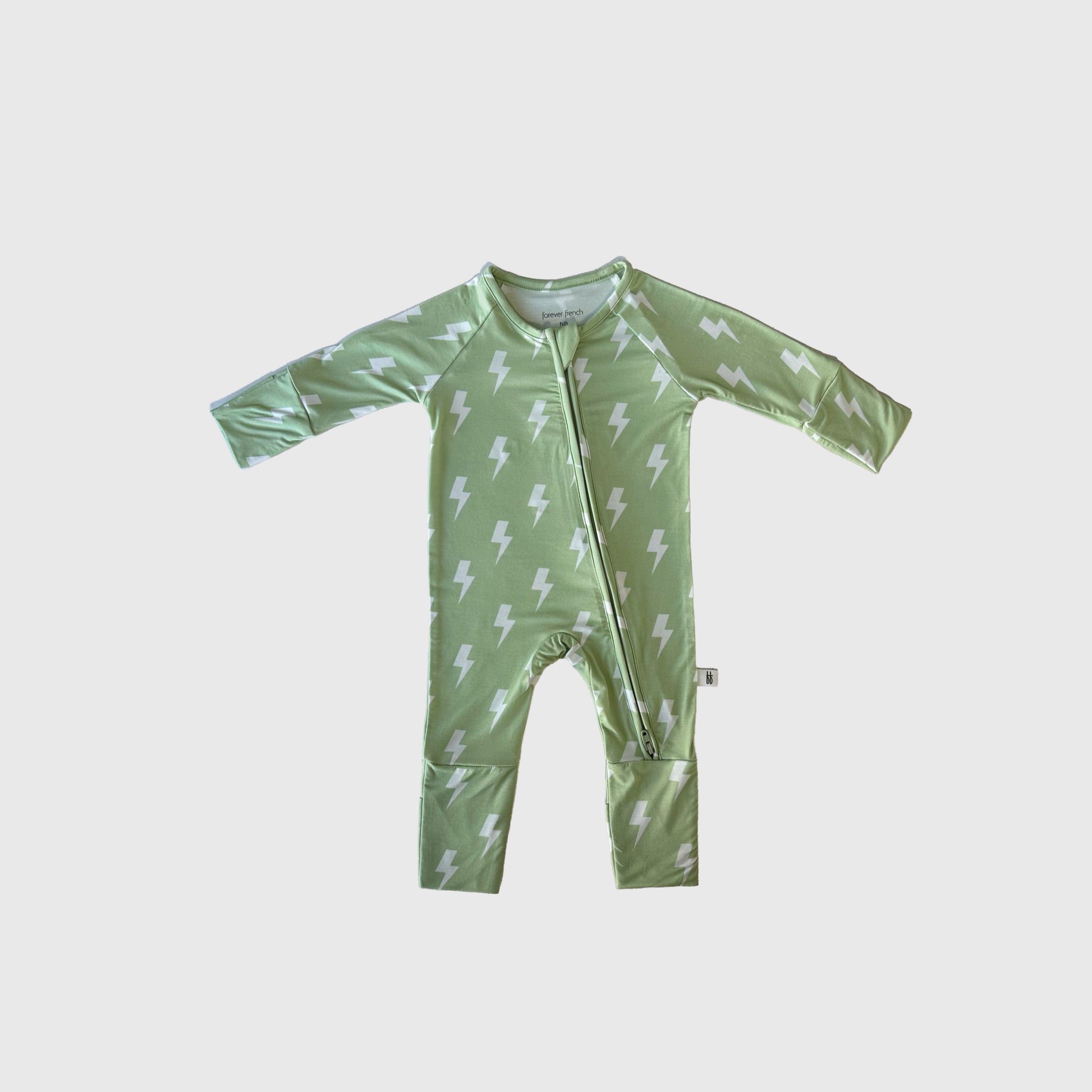 The Bamboo Zip Pajamas | Flash by forever french baby feature a light green bamboo fabric, white lightning bolt print, long sleeves, and a diagonal zipper—breathable, comfy sleepwear for babies.